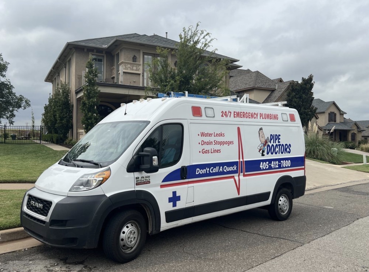 Pipe Doctors plumbing van in front of Rose Creek house.