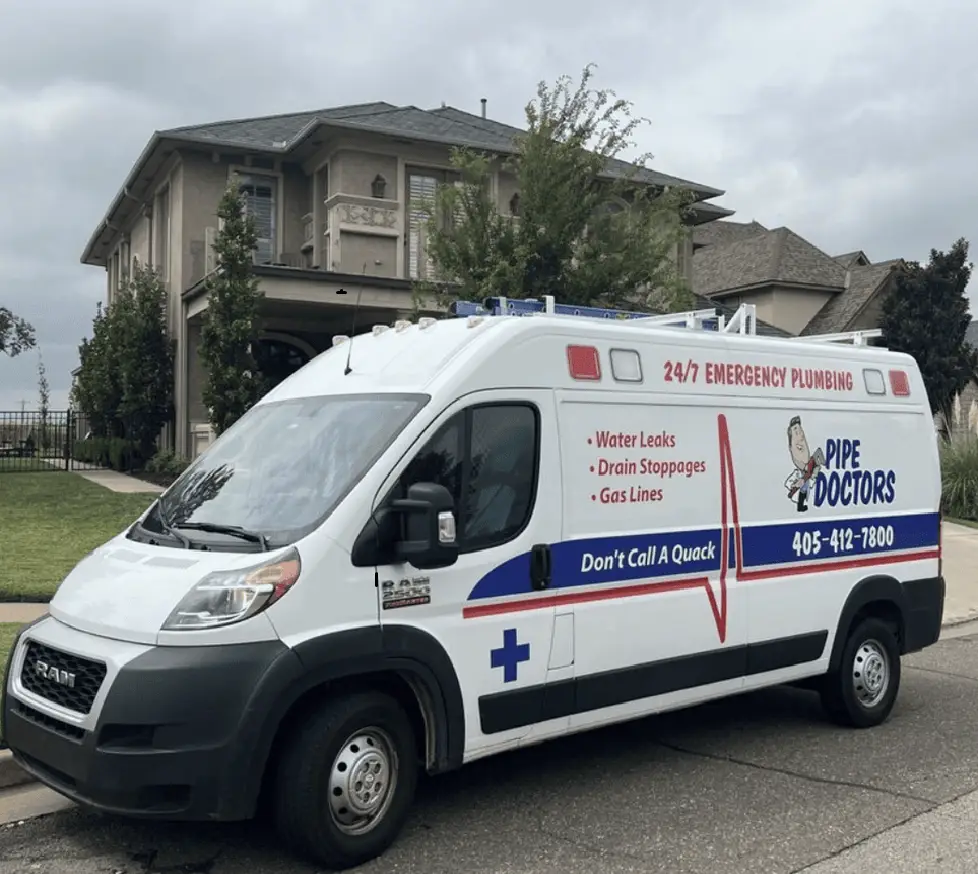 Pipe Doctors Oklahoma City plumbing service van parked in front of a residential home.